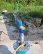 Well head with a submersible pump line