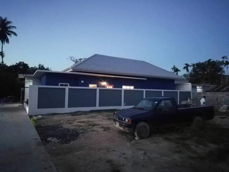 Exterior of the Maenam pool villa at dusk