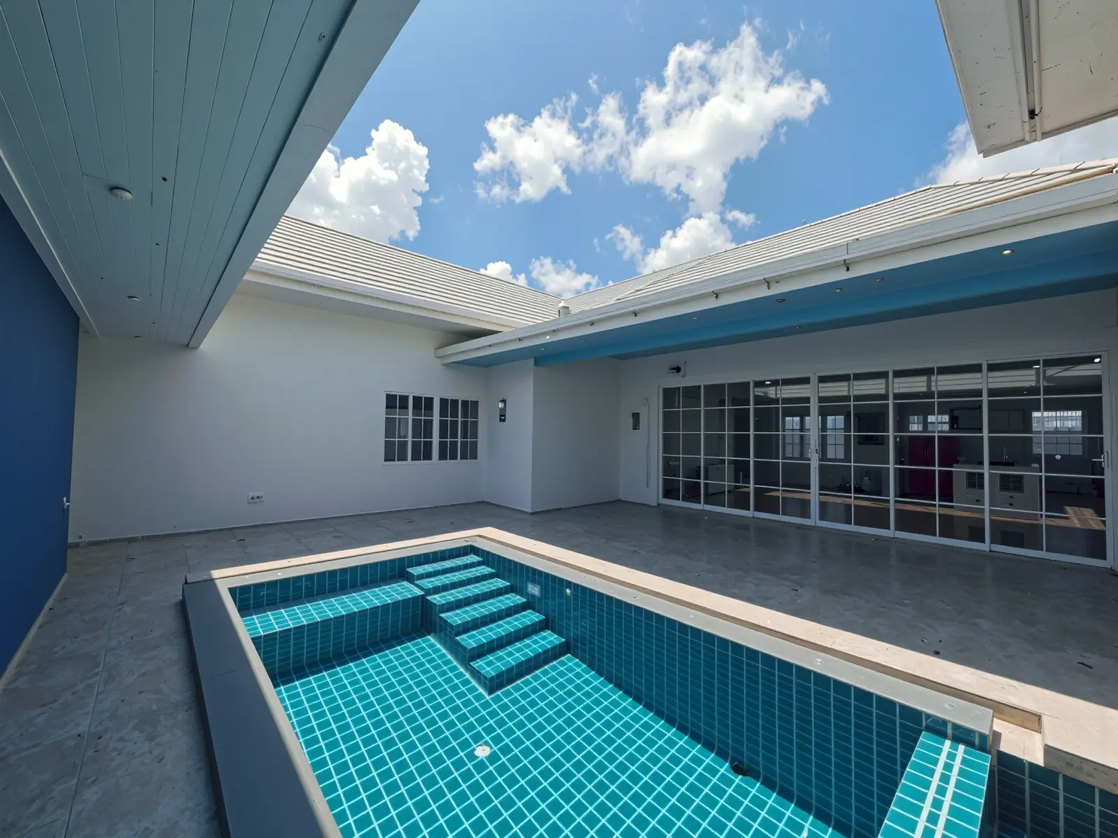Pool steps and terrace in daylight